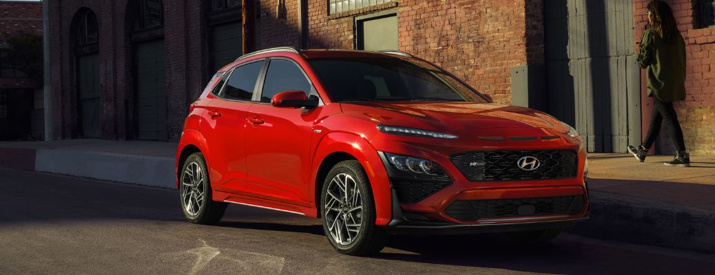 2023 Hyundai Kona Red parked on the side of the road