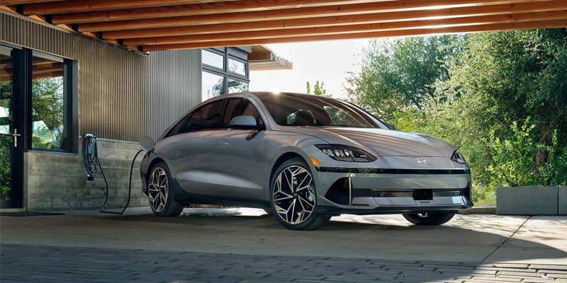 A 2024 Hyundai IONIQ 6 plugged in and charging in San Leandro, CA 