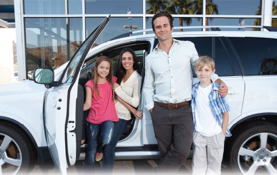 A happy family buying a car at San Leandro Hyundai in San Lenadro, CA 