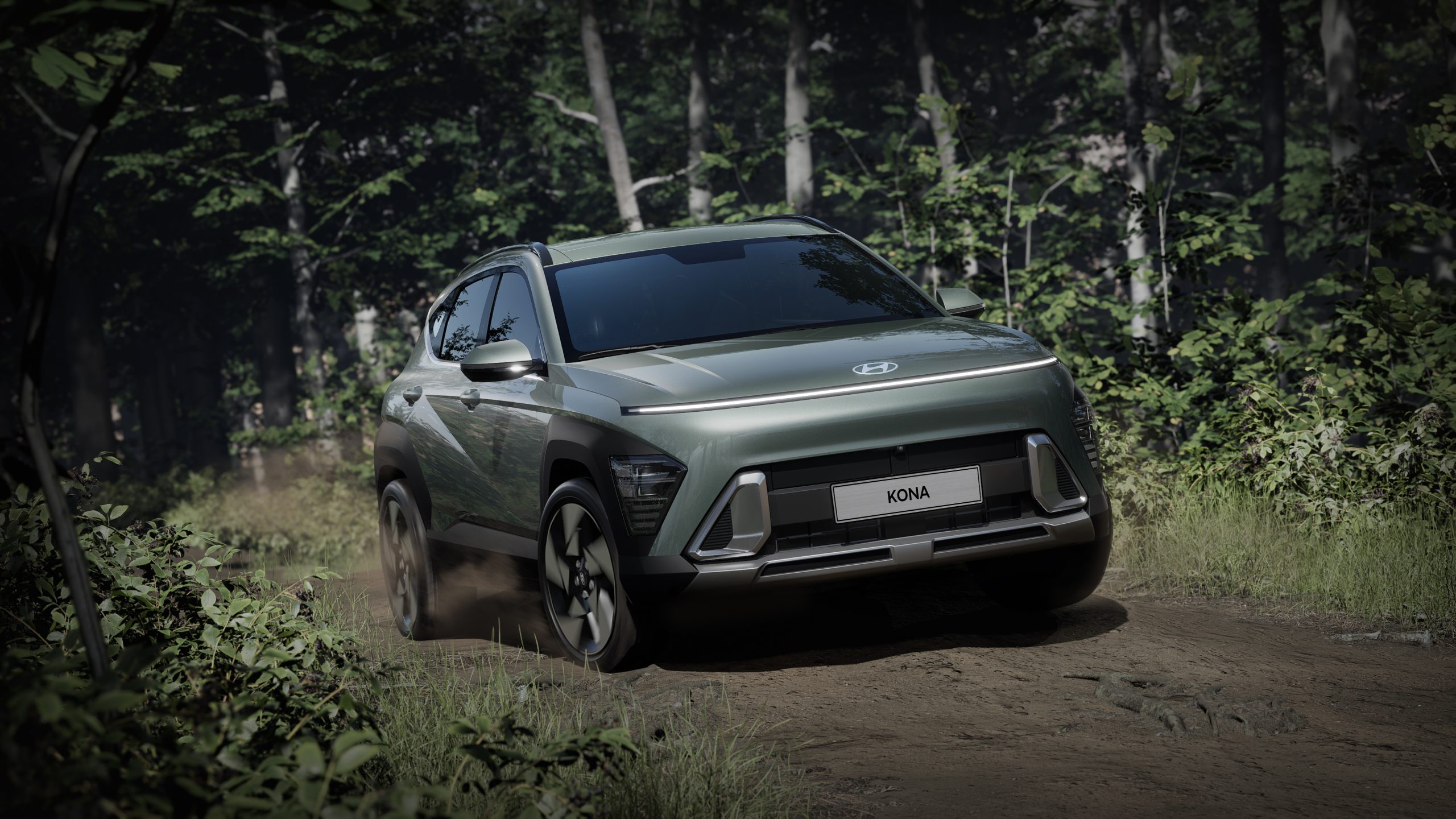2024 Hyundai Kona EV driving down a dirt road.