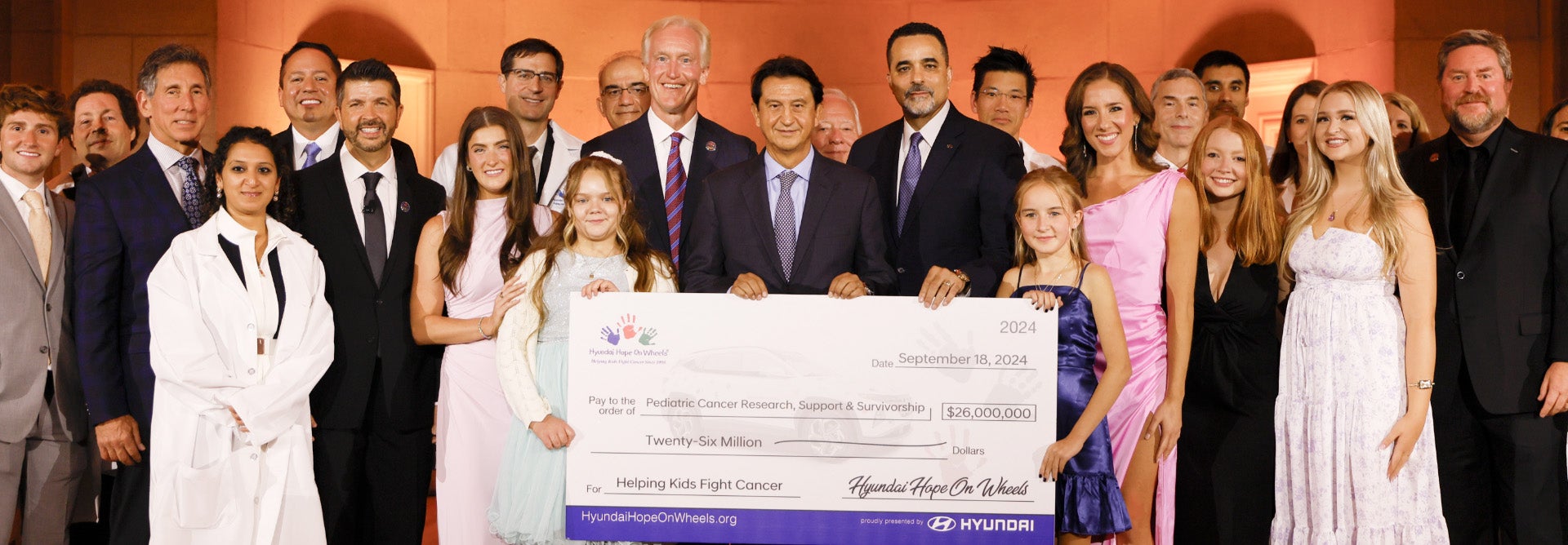 helping kids fight cancer foundation showing their big check from hyundai hope on wheels - San Leandro Hyundai in San Leandro CA